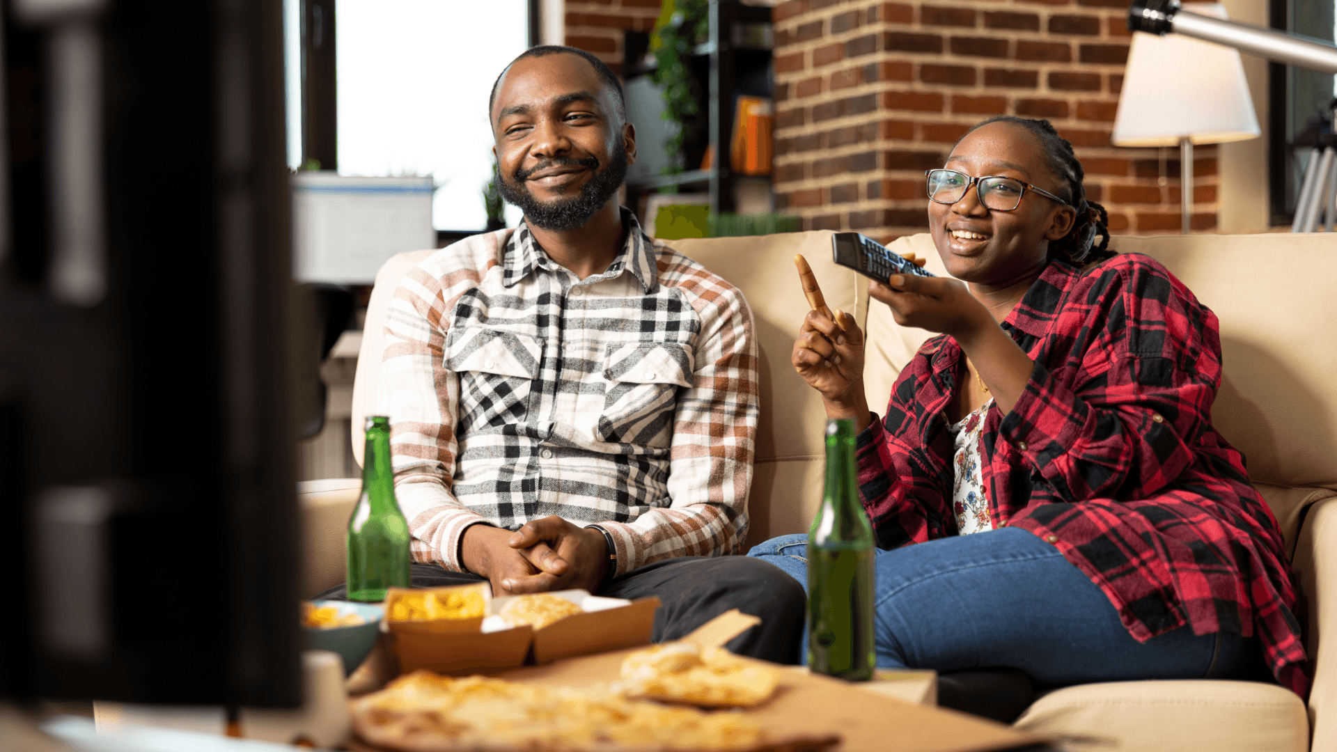 couple watching tv ads